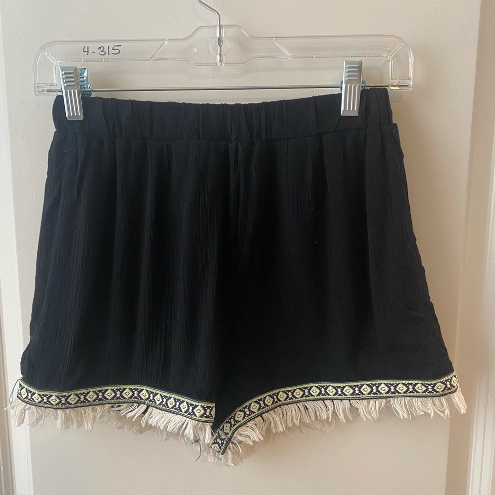 Black shorts with green and white trim